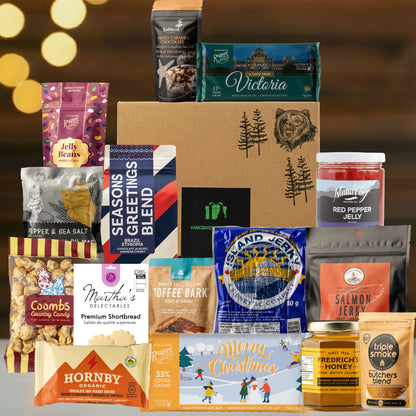 Assorted food products including snacks, candies, and jams on a wooden surface with a warm glow in the background.