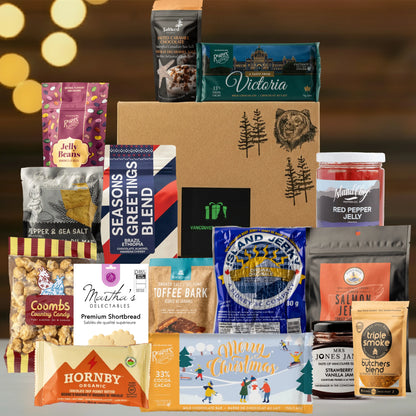 Assorted gourmet food products including cookies, jams, and spreads on a wooden surface with a warm glow in the background.